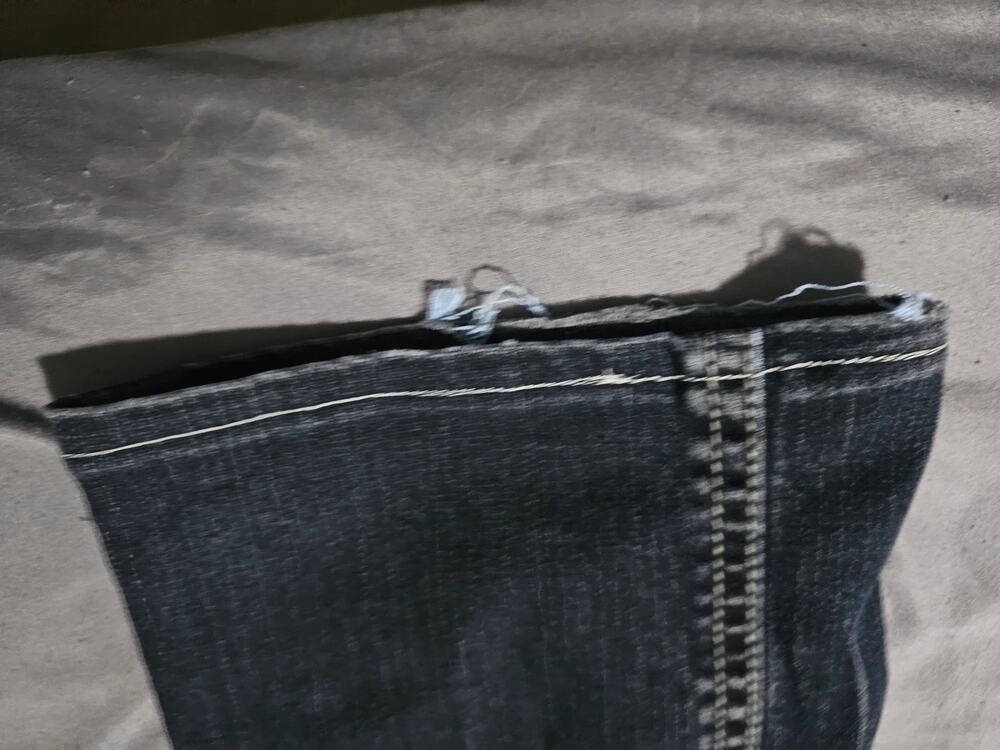 Dark wash embellished bootcut jeans contrast stitching faded whiskering